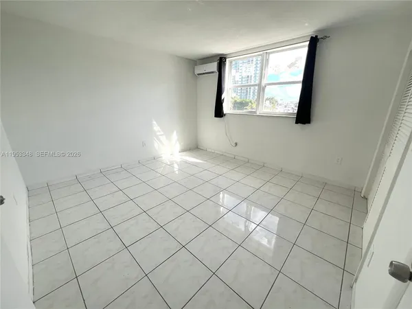 a view of an empty room and window