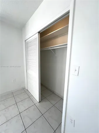 a view of a swimming pool with a lounge chairs