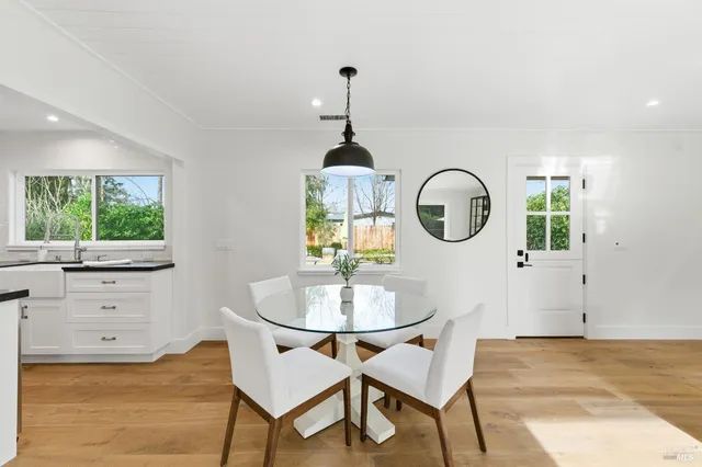 a kitchen with stainless steel appliances granite countertop a stove and a sink