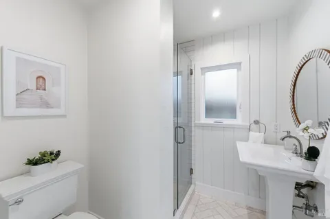 a bedroom with a large bed and a couch