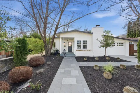 a front view of a house with garden