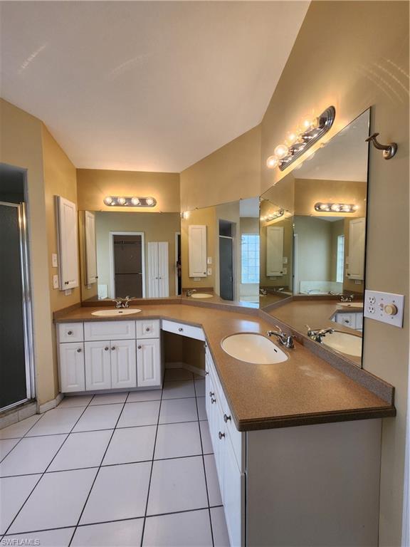 12796 Vista Pine Circle Fort Myers, FL 33913 - Photo 11 of 25 a large kitchen with a sink and cabinets