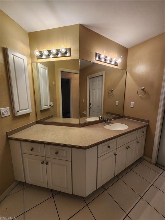 12796 Vista Pine Circle Fort Myers, FL 33913 - Photo 16 of 25 a bathroom with a double vanity sink and a mirror