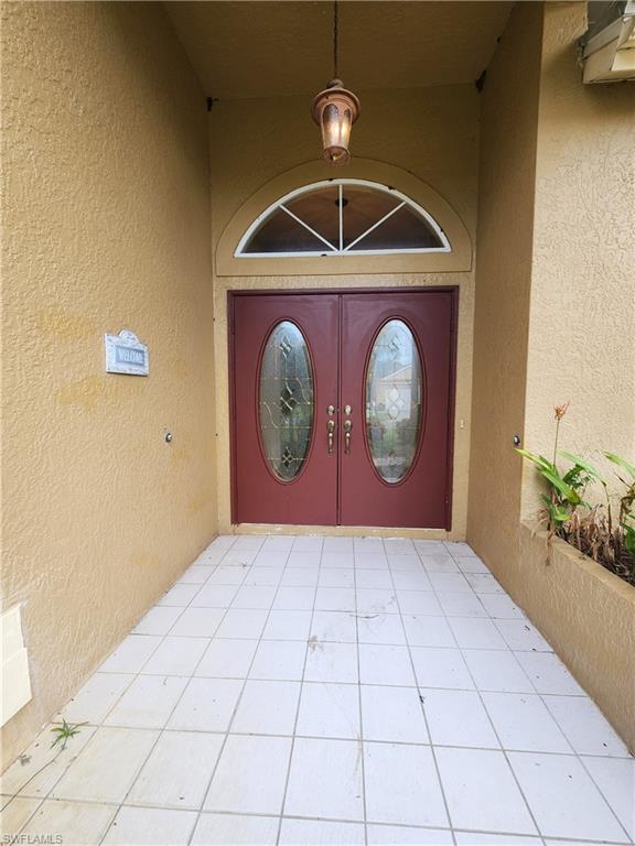 12796 Vista Pine Circle Fort Myers, FL 33913 - Photo 2 of 25 a front view of a house with garden