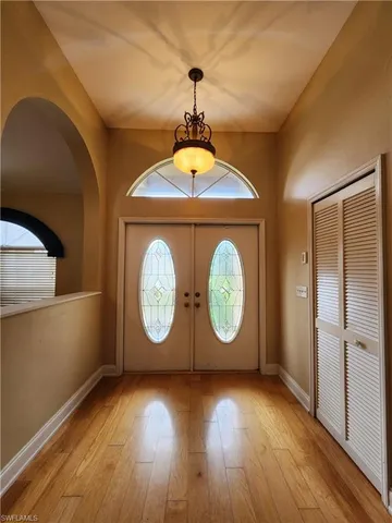 a view of a room with wooden floor