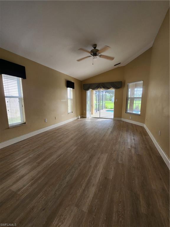 12796 Vista Pine Circle Fort Myers, FL 33913 - Photo 9 of 25 a view of an empty room with a window and wooden floor