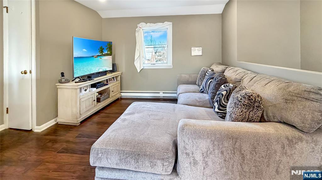 154 Charlton Avenue, Unit 2 Lodi, NJ 07644 - Photo 2 of 14 a living room with furniture and a flat screen tv