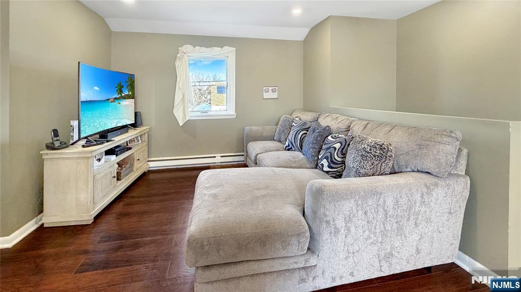 154 Charlton Avenue, Unit 2 Lodi, NJ 07644 - Photo 3 of 14 a living room with furniture and a flat screen tv