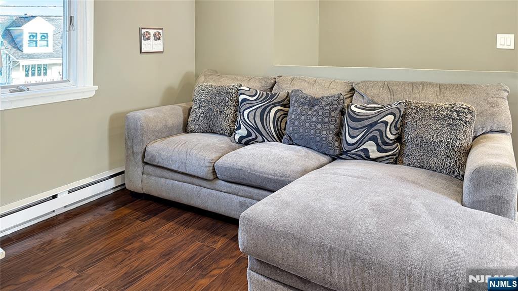 154 Charlton Avenue, Unit 2 Lodi, NJ 07644 - Photo 4 of 14 a living room with furniture and wooden floor