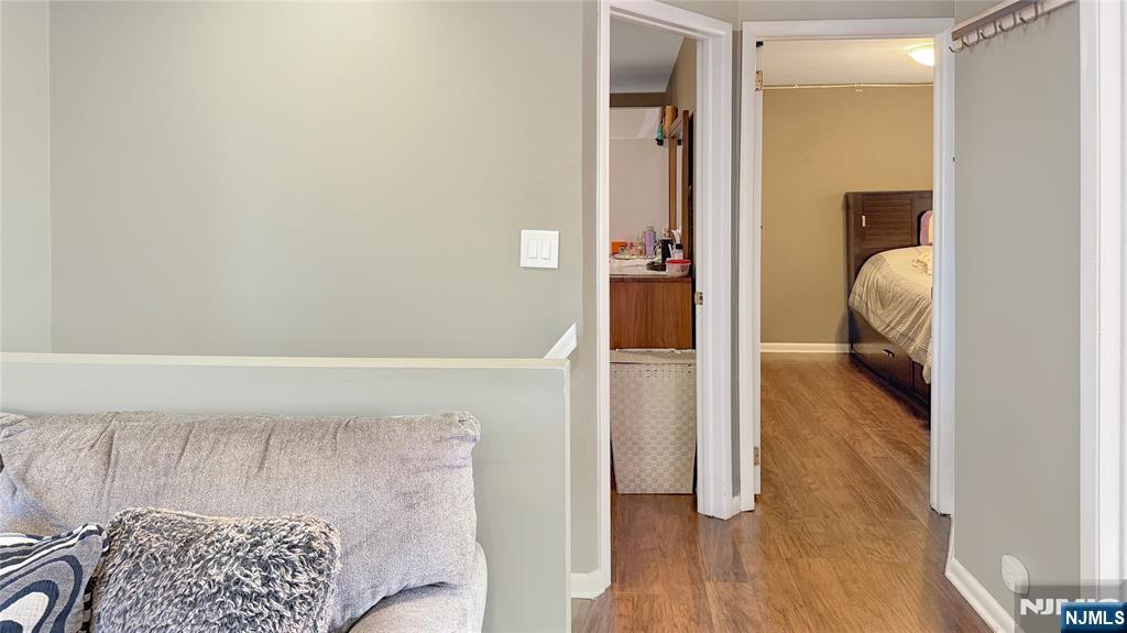 154 Charlton Avenue, Unit 2 Lodi, NJ 07644 - Photo 7 of 14 a view of hallway with wooden floor