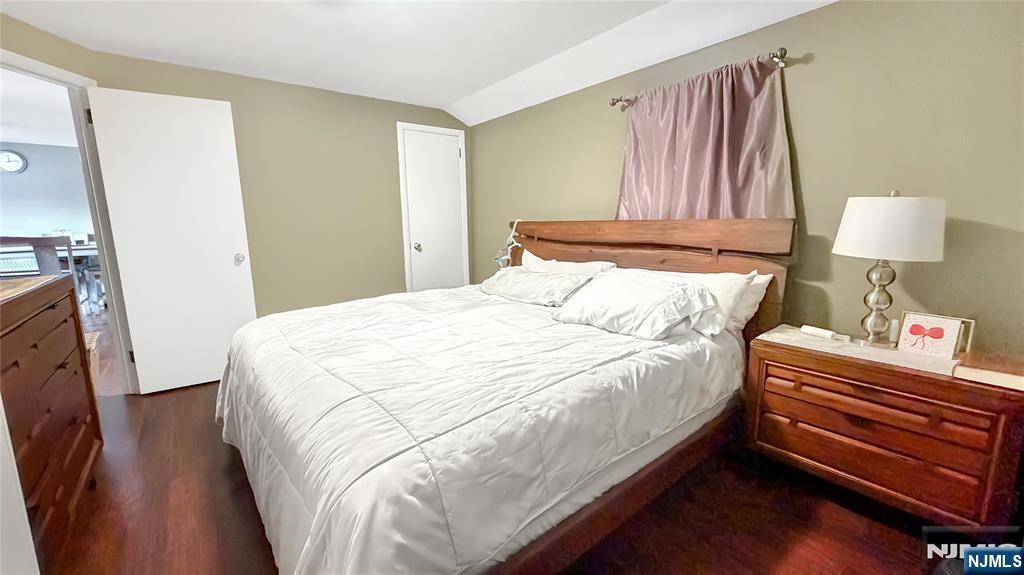 154 Charlton Avenue, Unit 2 Lodi, NJ 07644 - Photo 9 of 14 a bed sitting in a bedroom next to a lamp