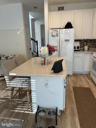 a kitchen with a table and chairs