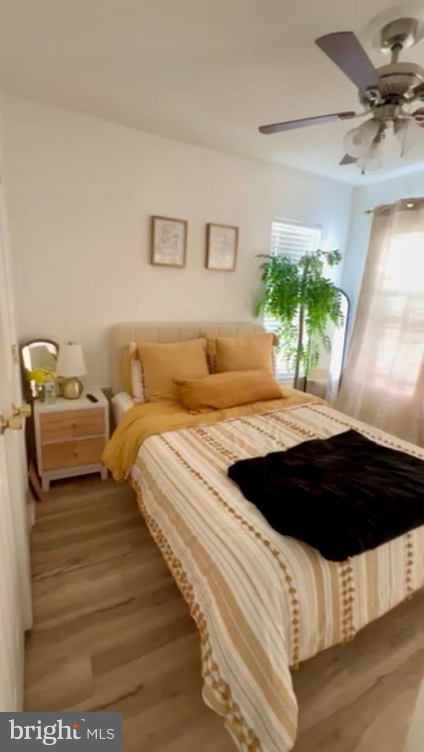 1701 Waltman Road Edgewood, MD 21040 - Photo 7 of 25 a bedroom with a bed window and a potted plant