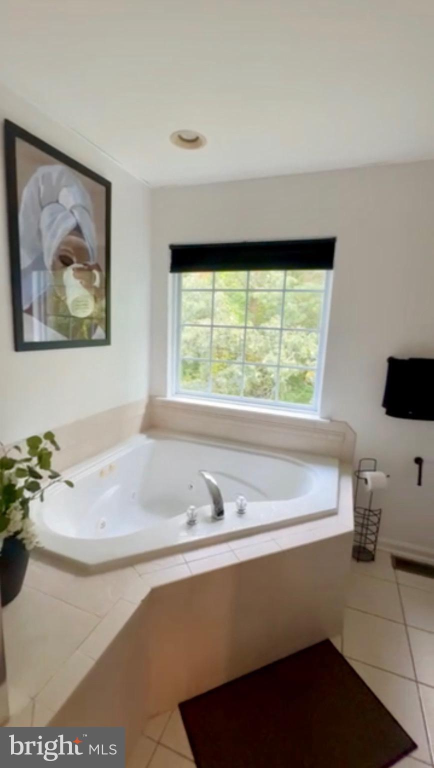 1701 Waltman Road Edgewood, MD 21040 - Photo 9 of 25 a bathroom with a bathtub and a sink