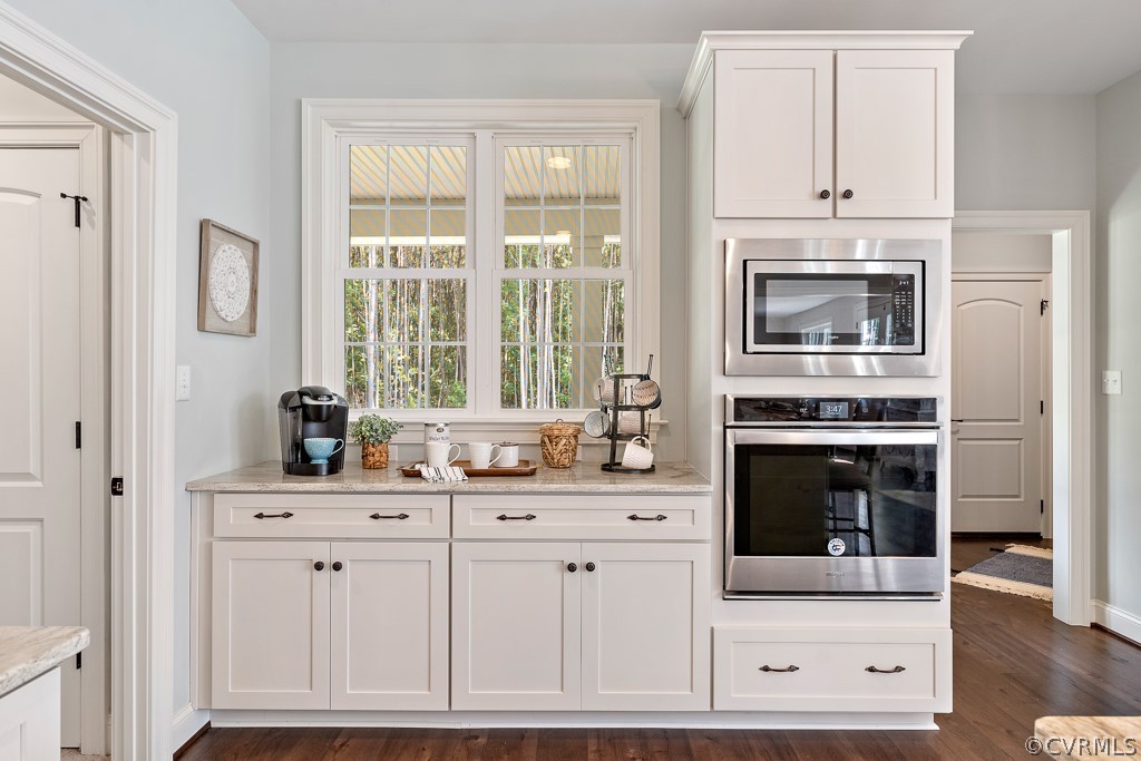 3033 Millmount Lane Powhatan, VA 23139 - Photo 16 of 49 a kitchen with stainless steel appliances white cabinets and a stove top oven