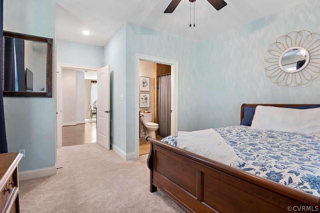 3033 Millmount Lane Powhatan, VA 23139 - Photo 23 of 49 a bedroom with a large bed and a chandelier