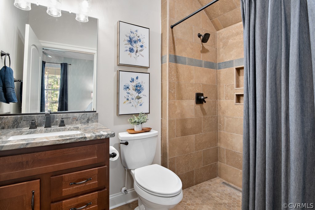 3033 Millmount Lane Powhatan, VA 23139 - Photo 24 of 49 a bathroom with a toilet a sink and shower