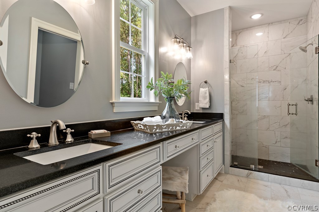 3033 Millmount Lane Powhatan, VA 23139 - Photo 27 of 49 a bathroom with a granite countertop sink a mirror and a shower