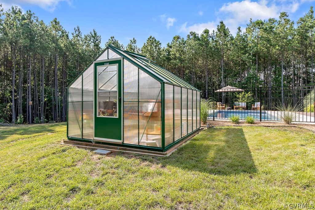3033 Millmount Lane Powhatan, VA 23139 - Photo 45 of 49 a view of a swimming pool with an outdoor seating and a garden
