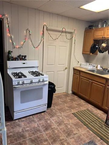 a kitchen with stainless steel appliances granite countertop a stove and a sink