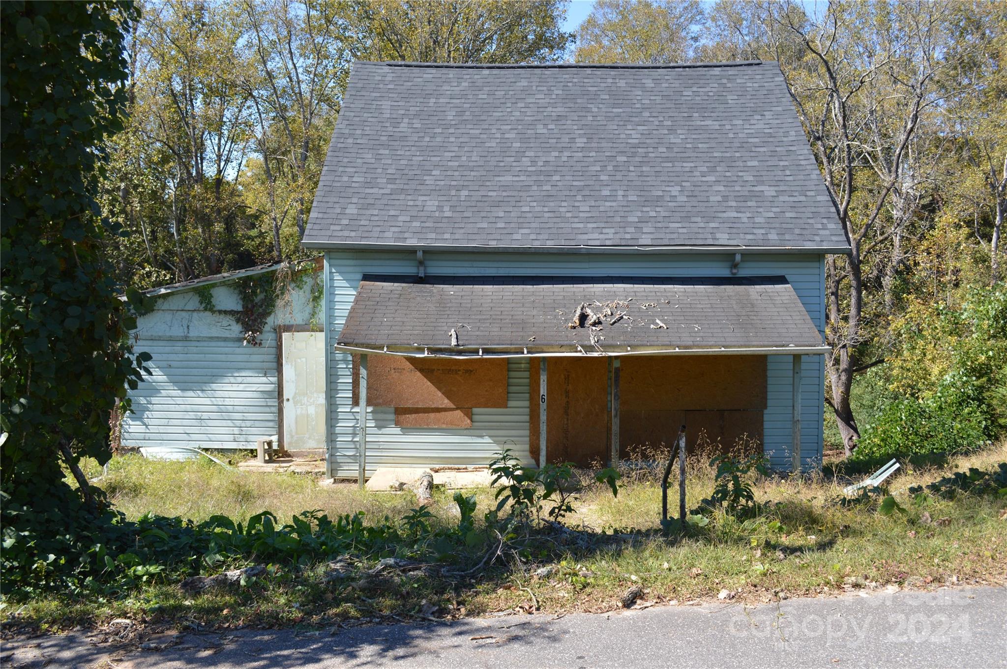 216 Walnut Avenue Rhodhiss, NC 28630 - Photo 1 of 7 front view of a house with a yard