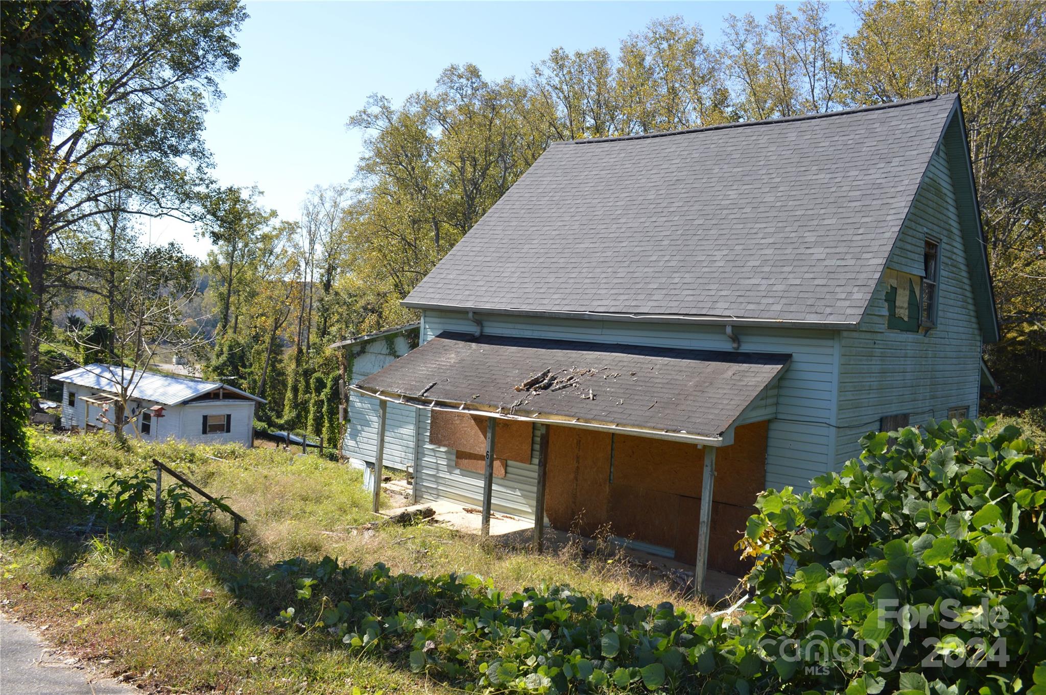 216 Walnut Avenue Rhodhiss, NC 28630 - Photo 3 of 7 aerial view of a house with a yard and sitting area