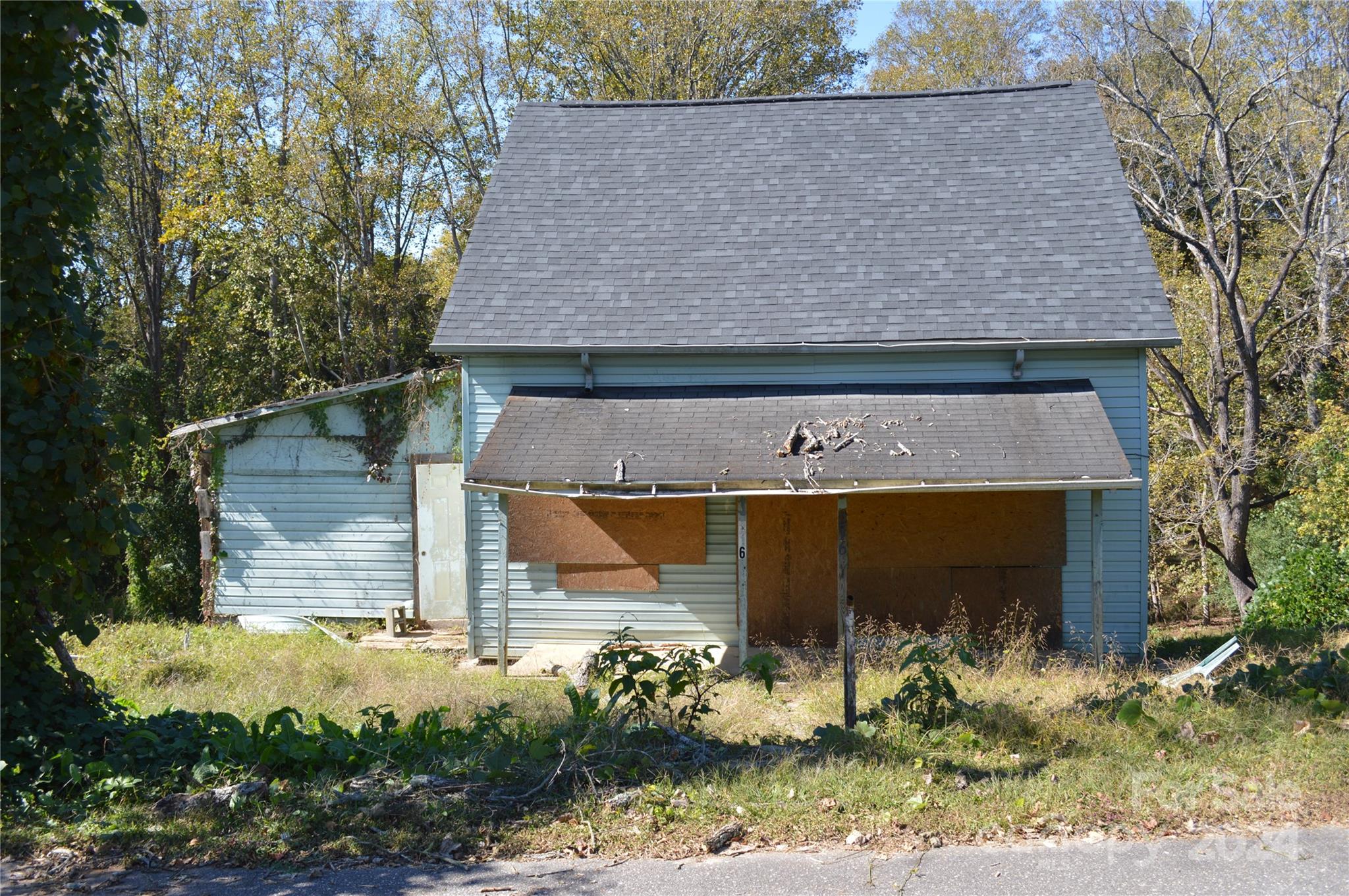 216 Walnut Avenue Rhodhiss, NC 28630 - Photo 5 of 7 front view of a house with a yard
