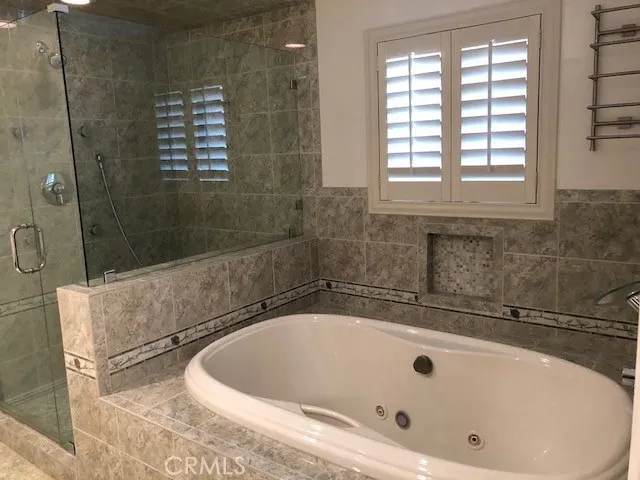 a kitchen with stainless steel appliances granite countertop a sink microwave and stove