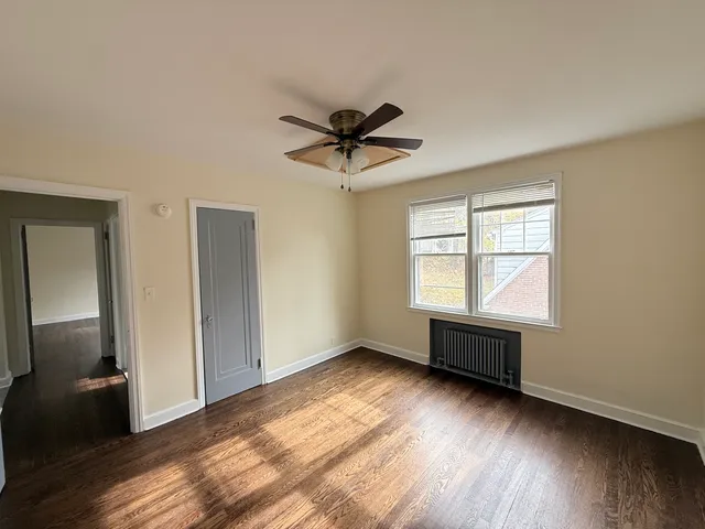 a view of room window and wooden floor
