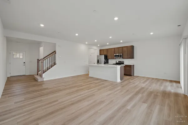 a kitchen with stainless steel appliances a sink stove and refrigerator