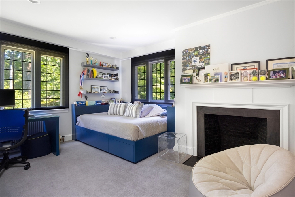 10 Spooner Road Brookline, MA 02467 - Photo 14 of 26 a living room with furniture and a fireplace