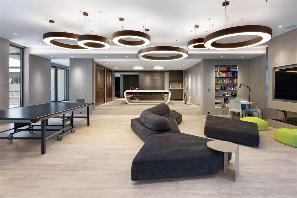 10 Spooner Road Brookline, MA 02467 - Photo 16 of 26 a living room with furniture and a flat screen tv