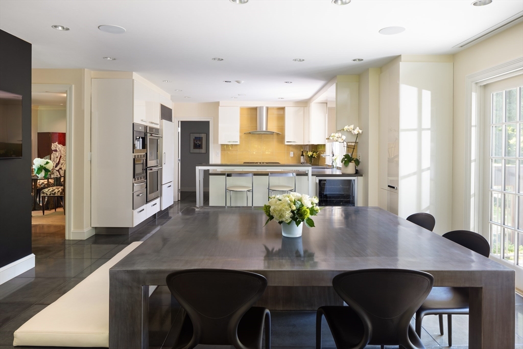 10 Spooner Road Brookline, MA 02467 - Photo 7 of 26 a view of a dining room with furniture and wooden floor