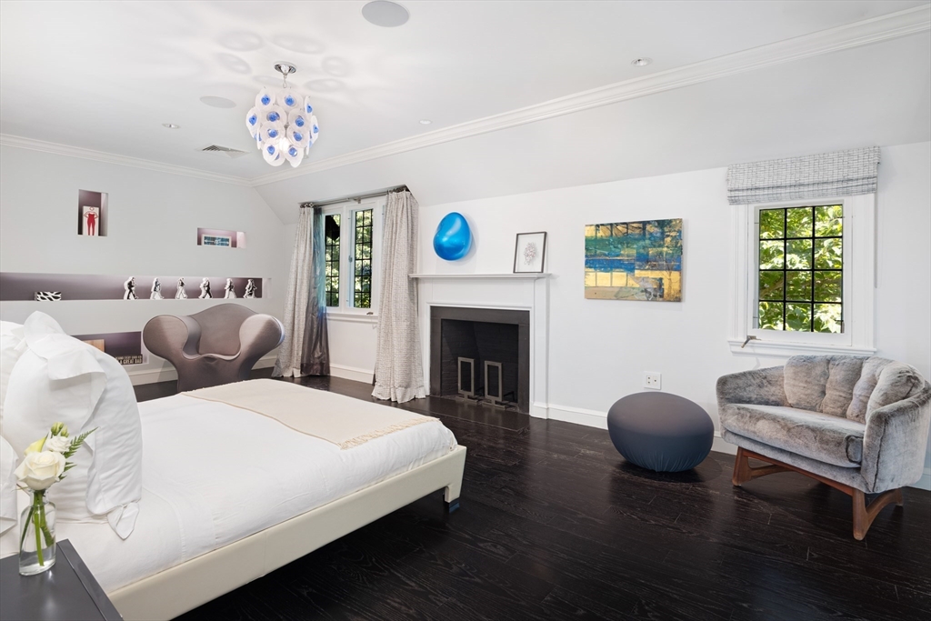 10 Spooner Road Brookline, MA 02467 - Photo 9 of 26 a living room with furniture and a fireplace