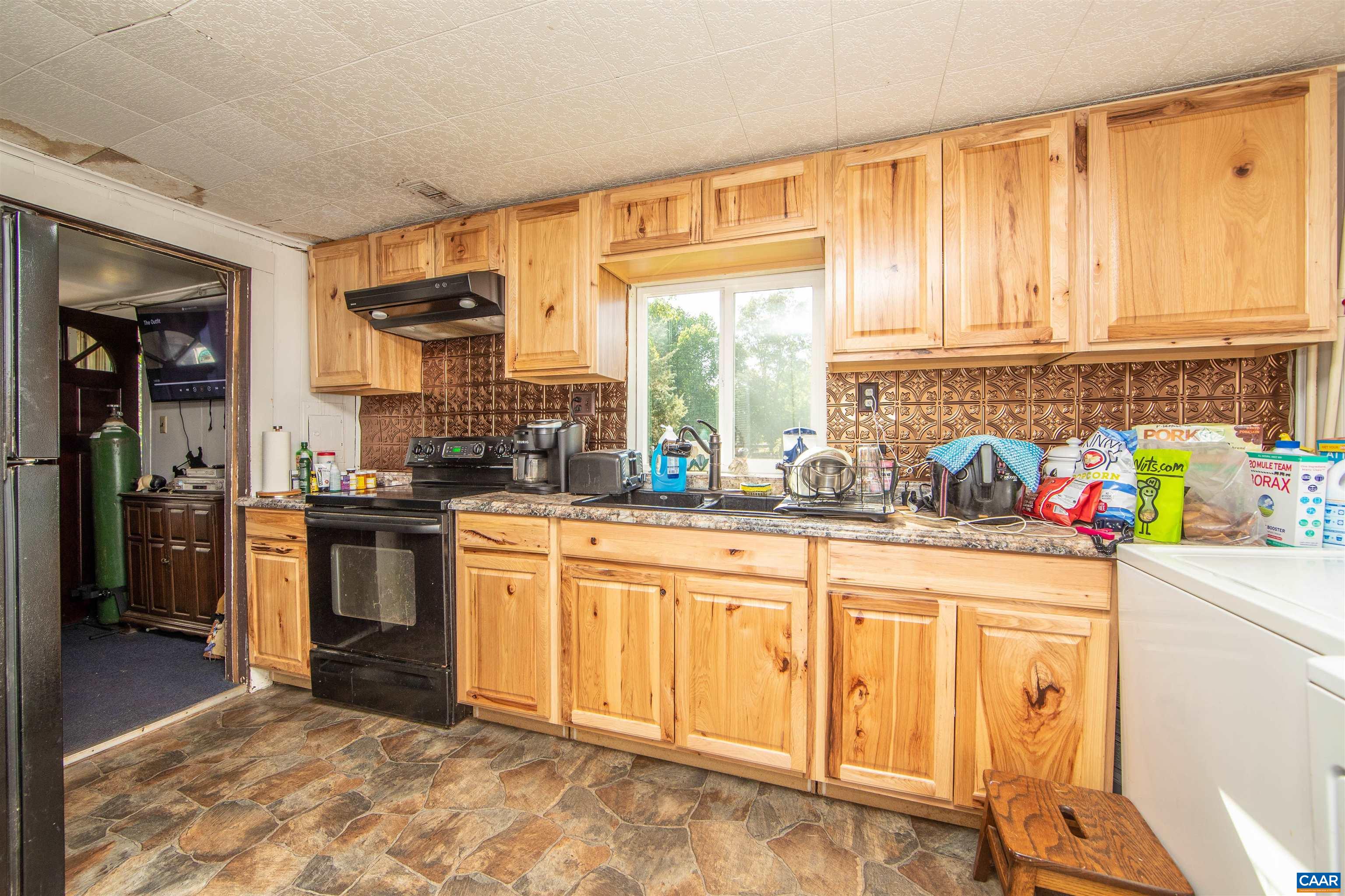 39 Dunsford Lane Dillwyn, VA 23936 - Photo 45 of 75 a kitchen with stainless steel appliances granite countertop a sink and a refrigerator