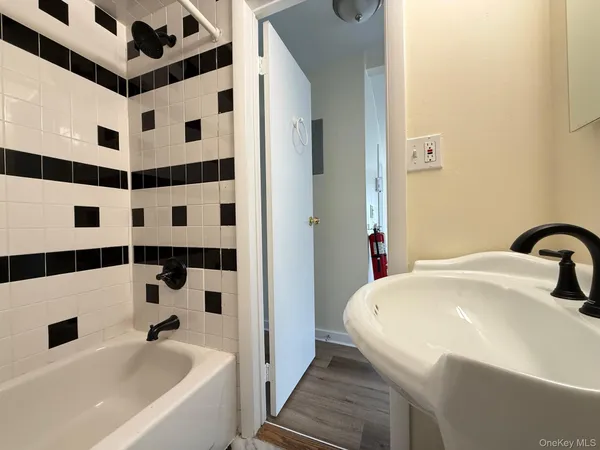a bathroom with a bathtub and a shower