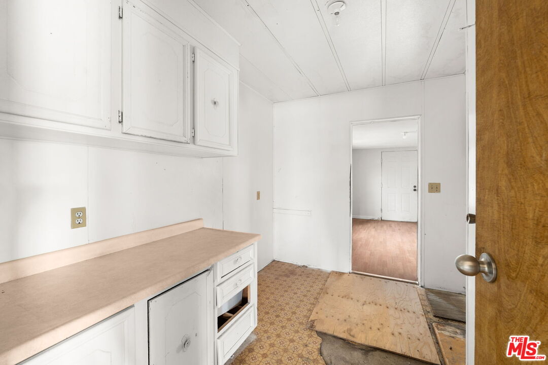 4388 Amador Road Phelan, CA 92371 - Photo 12 of 56 a kitchen with a sink and cabinets