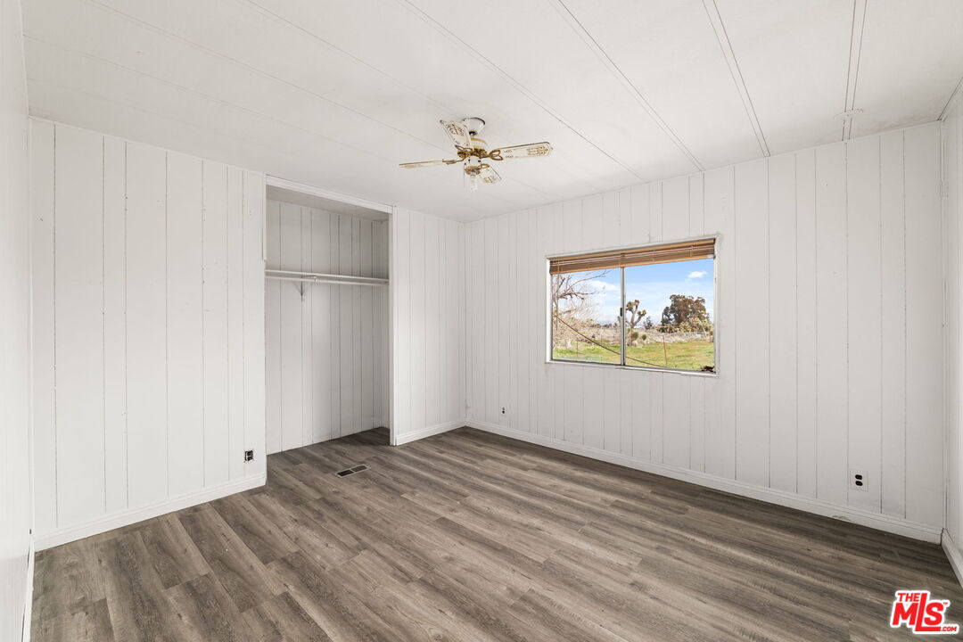 4388 Amador Road Phelan, CA 92371 - Photo 14 of 56 an empty room with windows and fan