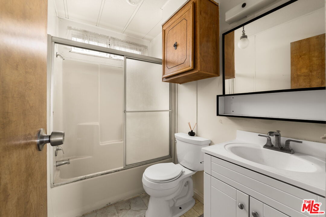 4388 Amador Road Phelan, CA 92371 - Photo 16 of 56 a bathroom with a toilet sink and shower