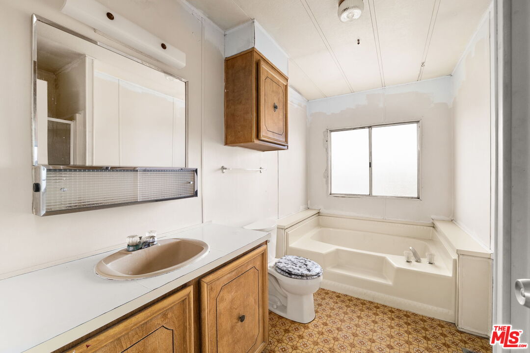 4388 Amador Road Phelan, CA 92371 - Photo 19 of 56 a bathroom with a sink and a bathtub