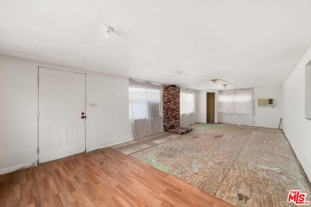 4388 Amador Road Phelan, CA 92371 - Photo 20 of 56 a view of a room with closet and wooden floor