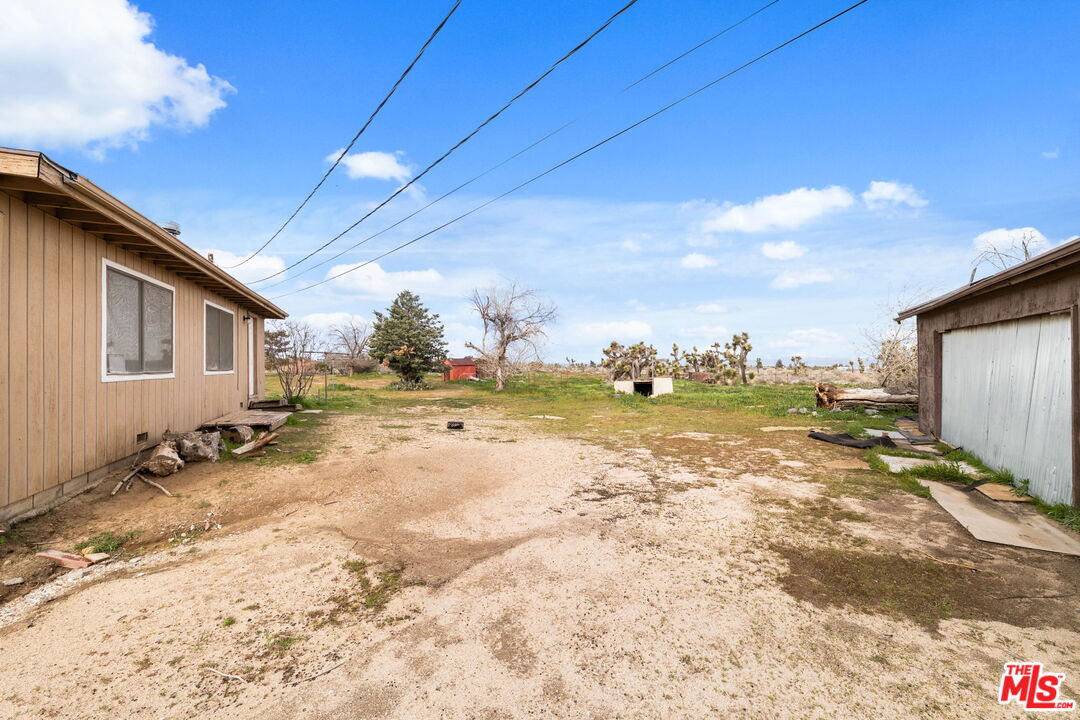 4388 Amador Road Phelan, CA 92371 - Photo 22 of 56 a view of a house with backyard and sitting area