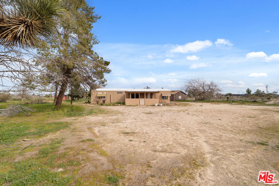 4388 Amador Road Phelan, CA 92371 - Photo 3 of 56 a view of a house with a yard