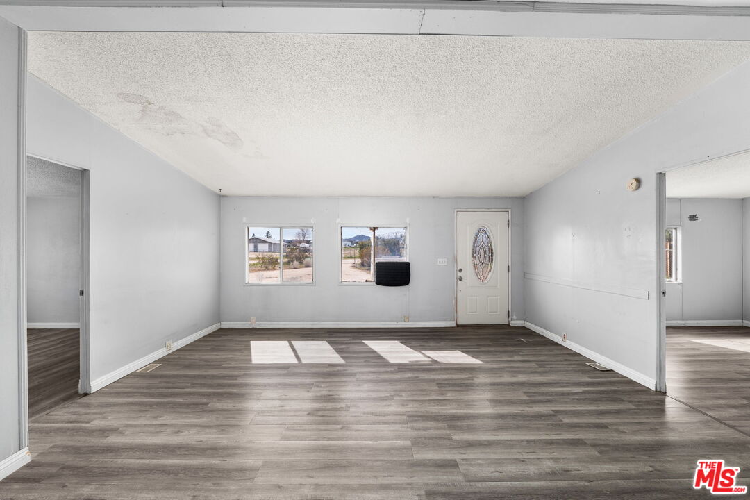 4388 Amador Road Phelan, CA 92371 - Photo 31 of 56 a view of empty room with wooden floor