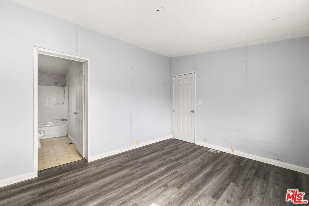 4388 Amador Road Phelan, CA 92371 - Photo 38 of 56 a view of a room with wooden floor
