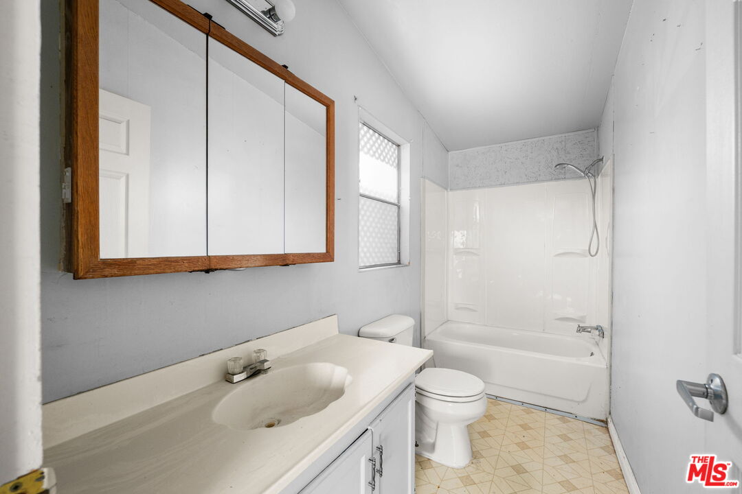 4388 Amador Road Phelan, CA 92371 - Photo 39 of 56 a bathroom with a sink a toilet and shower