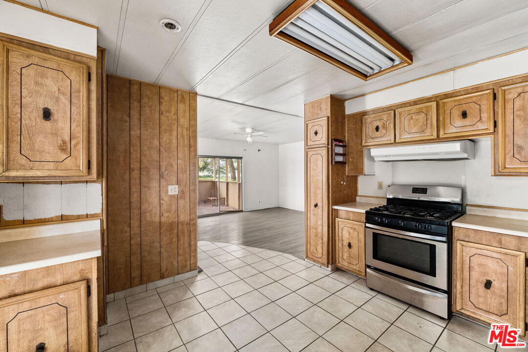 4388 Amador Road Phelan, CA 92371 - Photo 7 of 56 a kitchen with stainless steel appliances a stove and a refrigerator