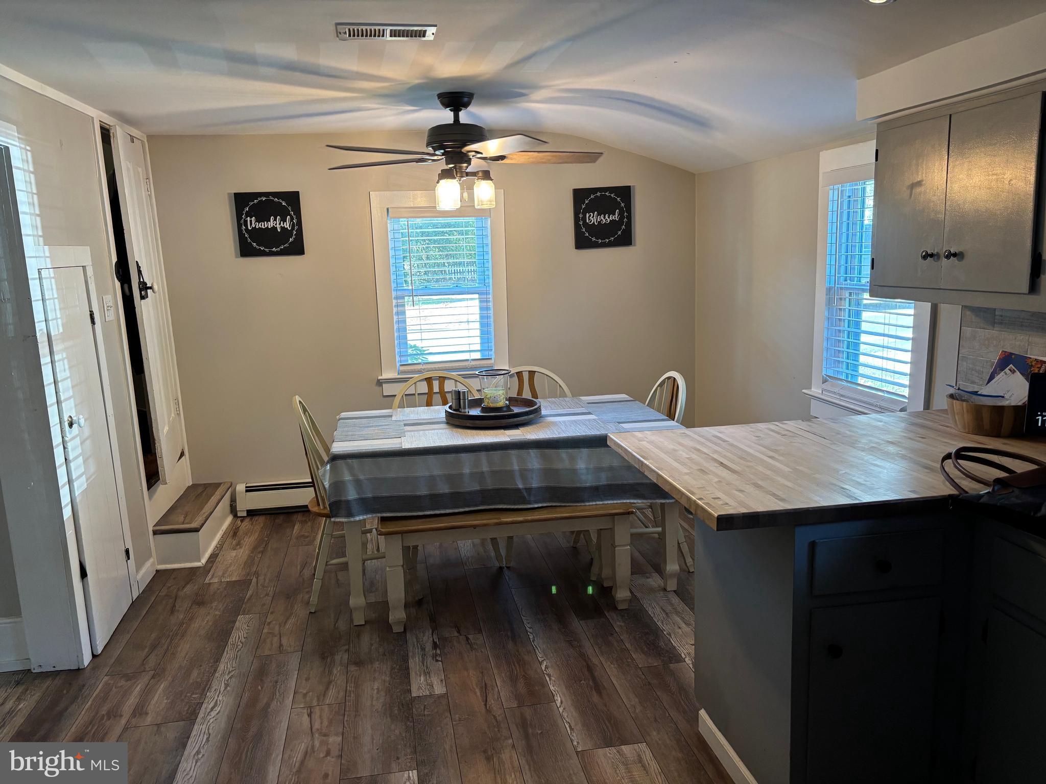70 Main Street Waretown, NJ 08758 - Photo 19 of 54 a kitchen with a table chairs and refrigerator