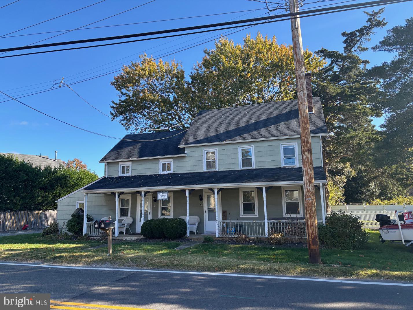 70 Main Street Waretown, NJ 08758 - Photo 2 of 54 a front view of a house with garden