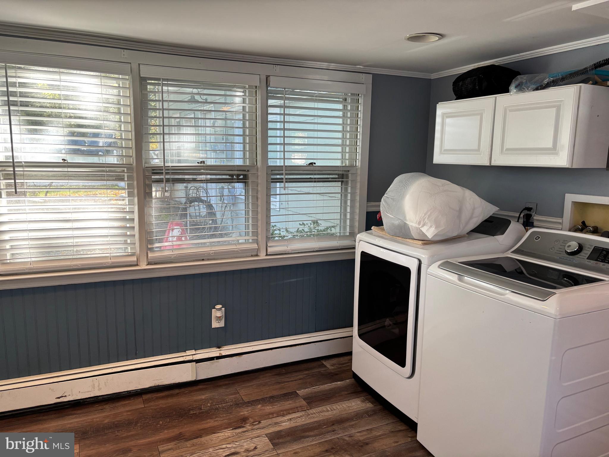 70 Main Street Waretown, NJ 08758 - Photo 27 of 54 a kitchen with a stove and white cabinets